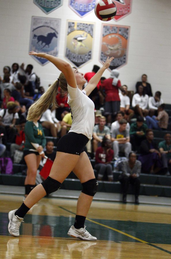 Junior Rachel Jacavage spikes the ball. Photo courtesy of Lifetouch