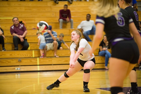 Grace Kelly digging up the volleyball to the setter. Photo courtesy of Lifetouch.