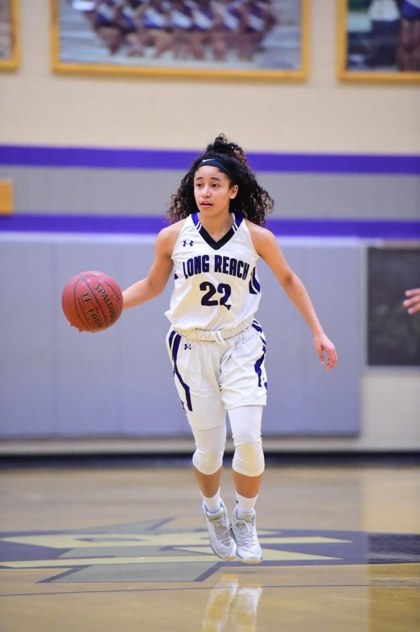Lyric Swann drives the ball down court. Photo courtesy of Lifetouch.